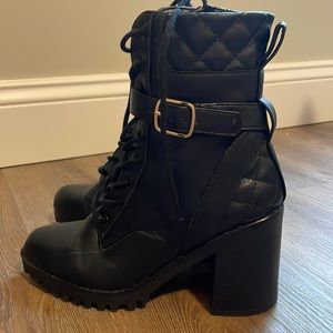 High heeled black booties